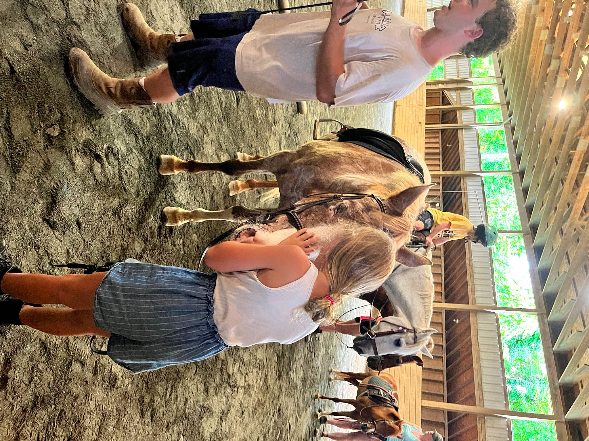 Bella is registered to the contest to win money with this photo: arm, clothing, denim, elbow, eyewear, fashion, fun, gesture, happy, human_body, human_leg, leisure, people_in_nature, person, photograph, recreation, sunglasses, t_shirt, thigh, tree