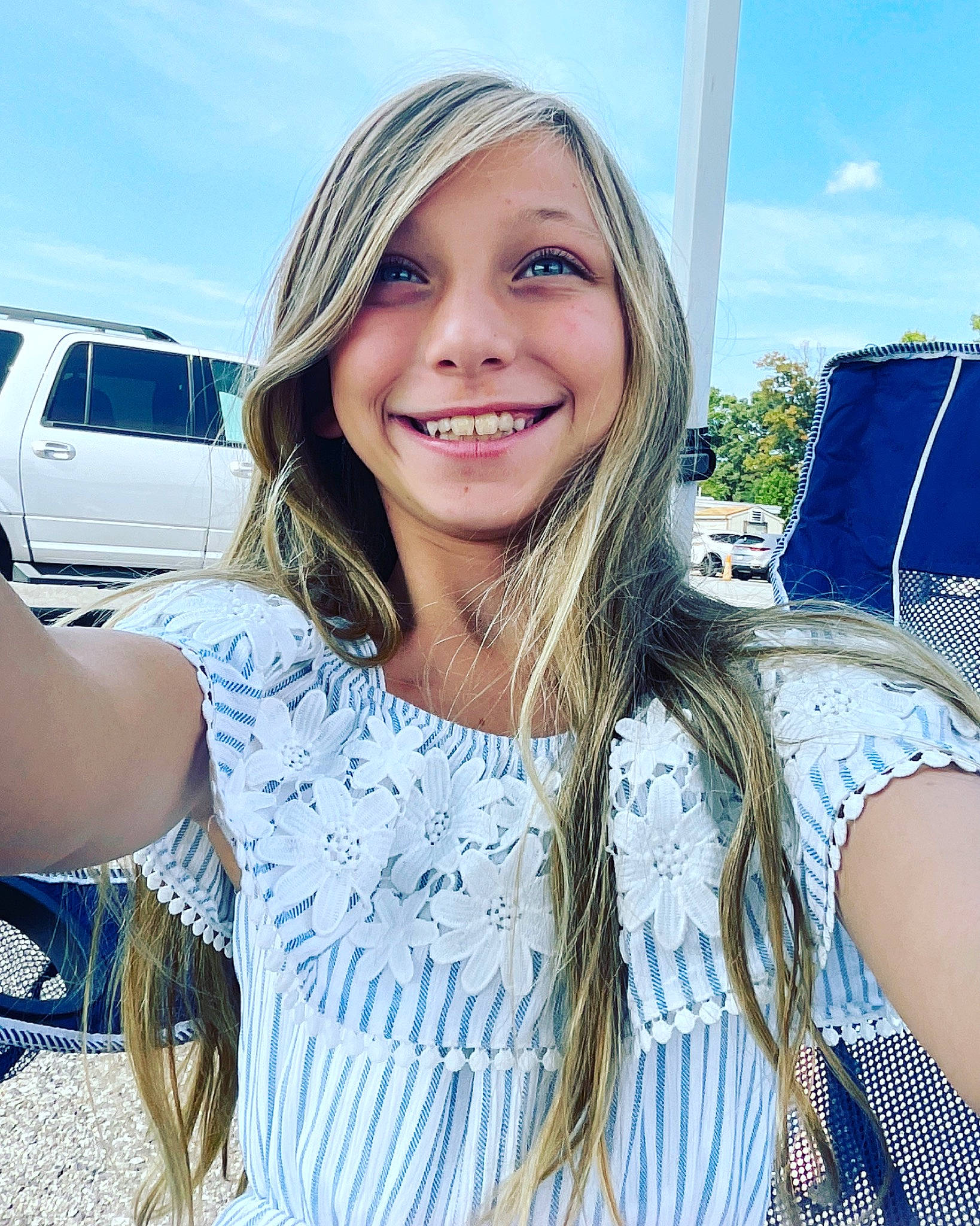 Bella is registered to the contest to win money with this photo: blond, blue, cool, daytime, electric_blue, eye, eyewear, flash_photography, grass, hair, happy, joy, layered_hair, lip, long_hair, neck, person, shoulder, sky, sleeve