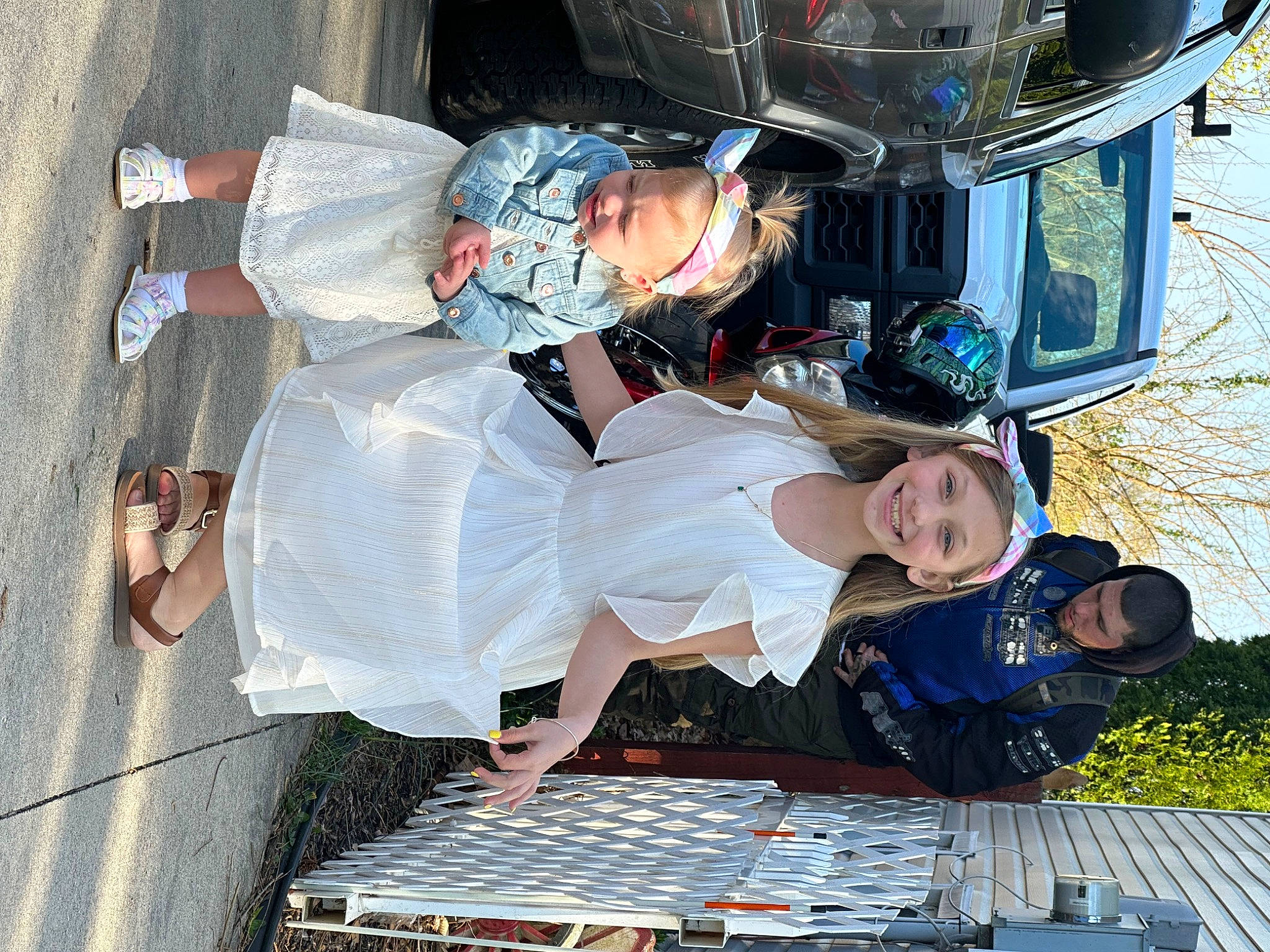 Bella is registered to the contest to win money with this photo: fun, hat, headwear, helmet, joy, leisure, light, person, plant, smile, toddler, tree, white