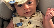 Adonis joined the competition — help win amazing prizes! baby, blanket, buttons, car_seat, child, close_up, cute, hands, happy, hat, indoor, infant, muslin, outfit, patterned_clothing, portrait, romper, seated, smiling, wide_eyed