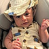 Adonis joined the competition — help win amazing prizes! baby, infant, child, portrait, smiling, wide_eyed, seated, car_seat, blanket, hat, outfit, romper, muslin, patterned_clothing, buttons, hands, indoor, close_up, cute, happy