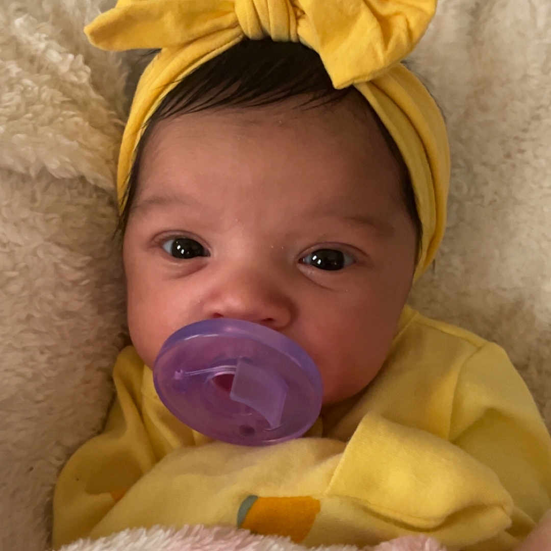 Imrielle joined the competition — help win amazing prizes! baby, bed, blanket, bodypart, bonnet, cap, clothing, face, finger, furniture, hand, happy, hat, head, newborn, person, photography, portrait, smile, towel