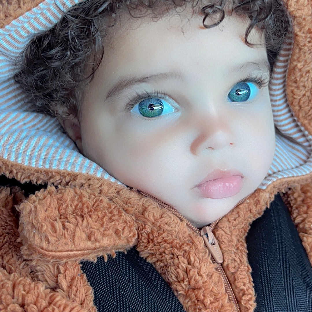Kaysen joined the competition — help win amazing prizes! baby, bonnet, cap, car, clothing, coat, cosmetics, face, hat, head, hood, hoodie, jacket, knitwear, lipstick, person, photography, portrait, sweater, sweatshirt