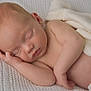 baby, newborn, sleeping, blanket, soft, knitted, skin, peaceful, infant, closeup, wrapped, resting, cute, child, portrait, napping, cozy, natural_light, relaxing, tender