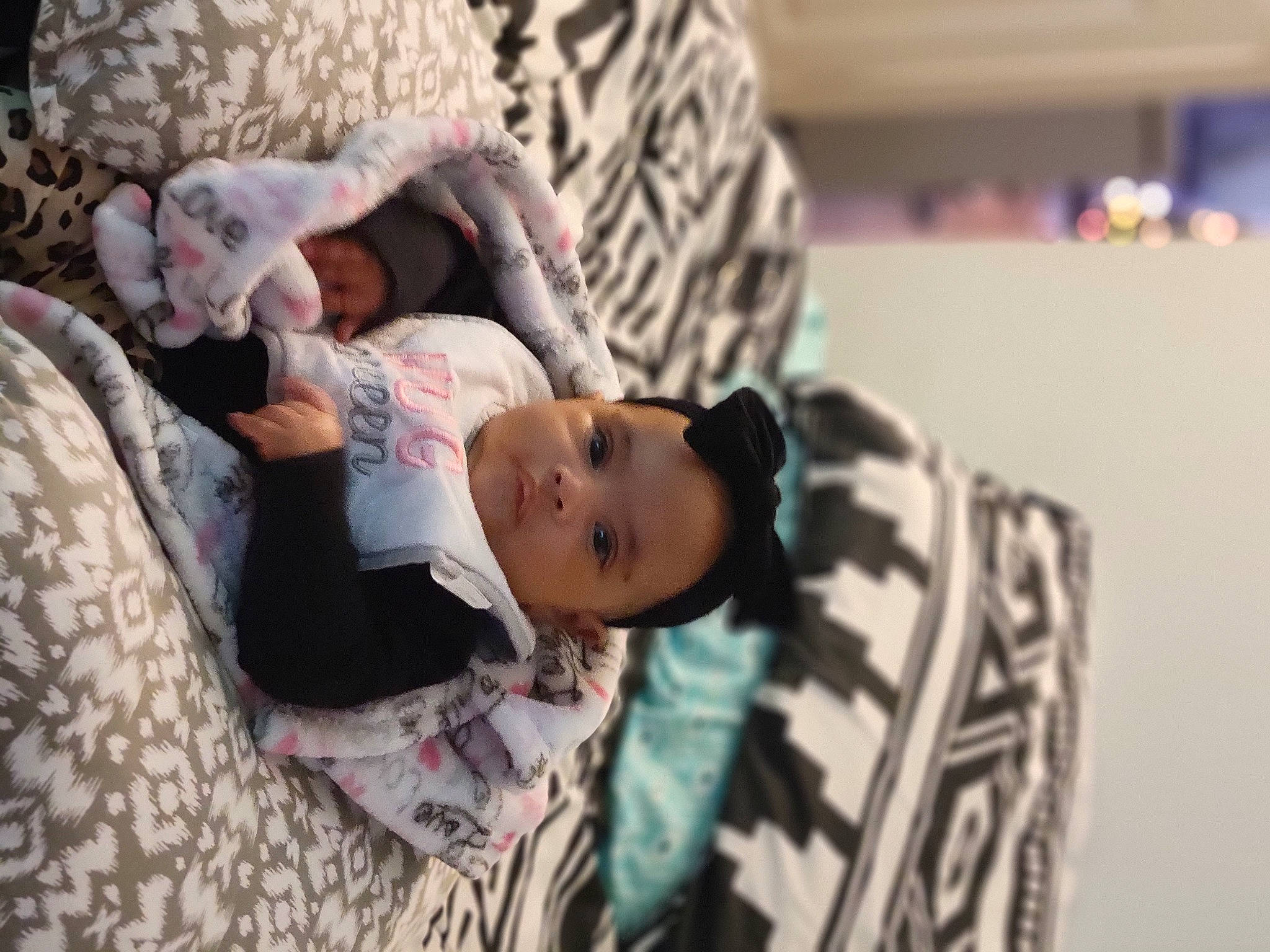 Brooklynn is registered to the contest to win money with this photo: baby, bedding, child, comfort, couch, eyelash, fashion_design, fur, happy, linens, pattern, person, room, sitting, skin, street_fashion, toddler, toy, tree