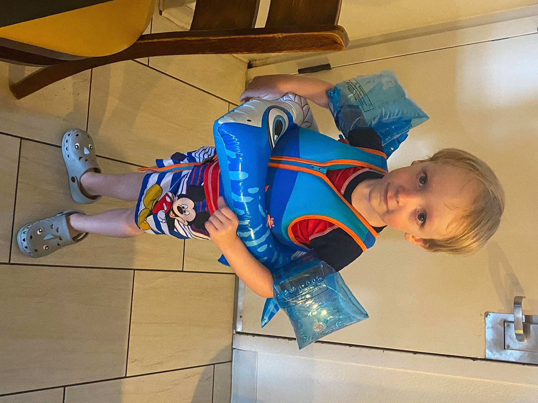 Aiden is registered to the contest to win money with this photo: basketball, child, elbow, electric_blue, fun, hat, human_leg, knee, person, room, shorts, sportswear, t_shirt, thigh, toddler, uniform, wrist