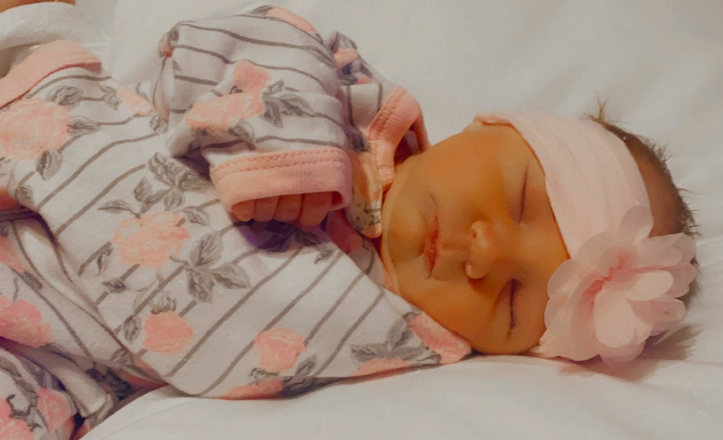 Allison is registered to the contest to win money with this photo: baby, baby_sleeping, baby_toddler_clothing, cheek, child, comfort, eye, eyelash, finger, hand, headwear, human_body, linens, lip, mouth, nose, person, pink, skin, sleeve