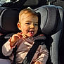 Luna a rejoint le concours — aidez-le/la à gagner de superbes lots ! baby, buckle, car_interior, car_seat, cheeks, child, closeup, clothing, hand, headrest, infant, pink_sweater, playful, portrait, seatbelt, smile, sticking_tongue, sunlight, toddler, tongue_out