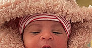 Raydynn is registered to the contest to win money with this photo: baby, bear_ears, bundle, clothing, cute, digital_overlay, face, fluffy, hand, hat, indoors, infant, newborn, notifications, phone_screen, pink, portrait, sleepy, time_display, warm