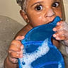 bath, bathroom, blue_toy, bubbles, child, cleaning, curious, cute, face, foam, fun, hands, indoor, play, soap, toddler, water, wet_skin, whale_toy, young_child