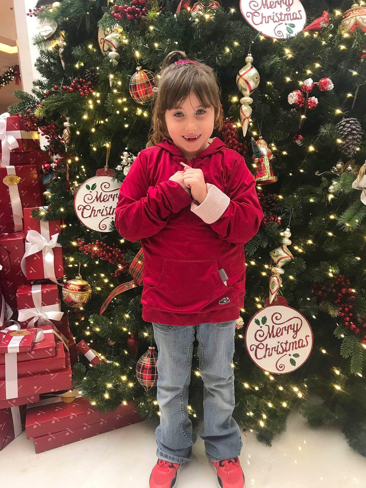 Lily joined the competition — help win amazing prizes! child, christmas, christmas_decoration, christmas_eve, christmas_ornament, christmas_tree, conifer, event, fir, holiday, interior_design, joy, outerwear, person, pine_family, plant, red, smile, toddler, tree