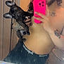 person, dog, french_bulldog, puppy, mirror, selfie, shirtless, tattoo, phone, pink_phone_case, bathroom, sink, hairbrush, ears, curly_hair, tattoos, reflection, hand, looking, casual