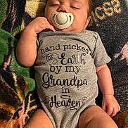 Malaki joined the competition — help win amazing prizes! baby, pacifier, onesie, sleeping, infant, blanket, clothing, child, cute, resting, toddler, human, skin, arm, hand, leg, text, fabric, soft, comfort