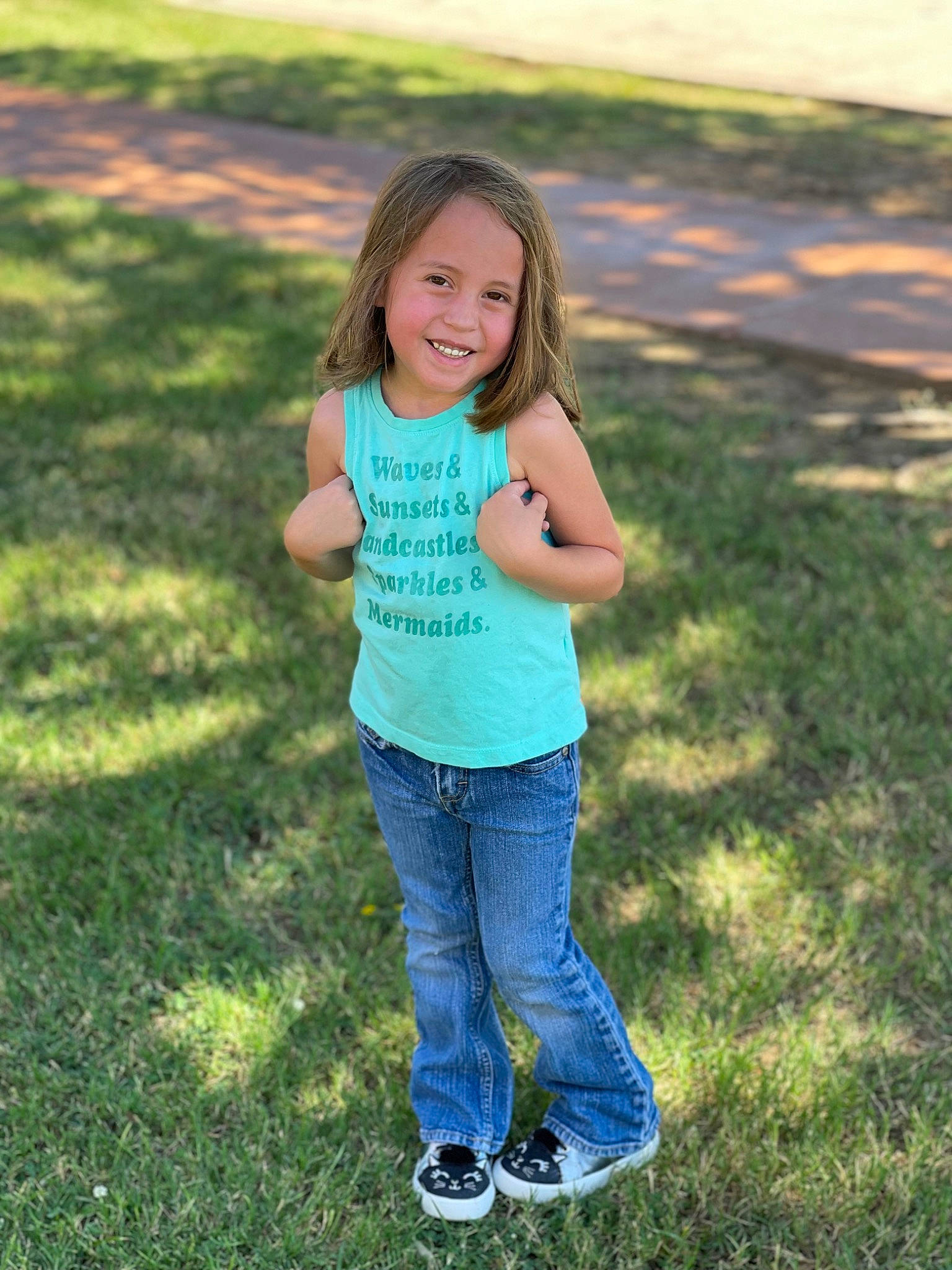 Laila is registered to the contest to win money with this photo: arm, denim, face, grass, grass_family, grassland, hand, happy, human_body, jeans, joy, leisure, meadow, people_in_nature, person, plant, recreation, smile, summer, sunlight