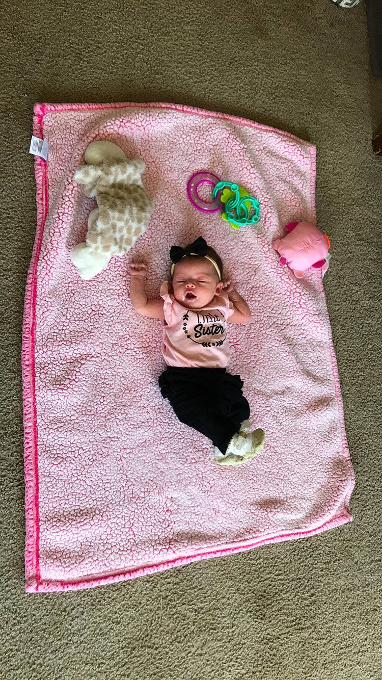 Vyvian is registered to the contest to win money with this photo: baby, baby_products, baby_toddler_clothing, comfort, craft, flooring, linens, magenta, needlework, pattern, person, pink, sleeve, sock, stitch, t_shirt, textile, toddler, wool, woven_fabric