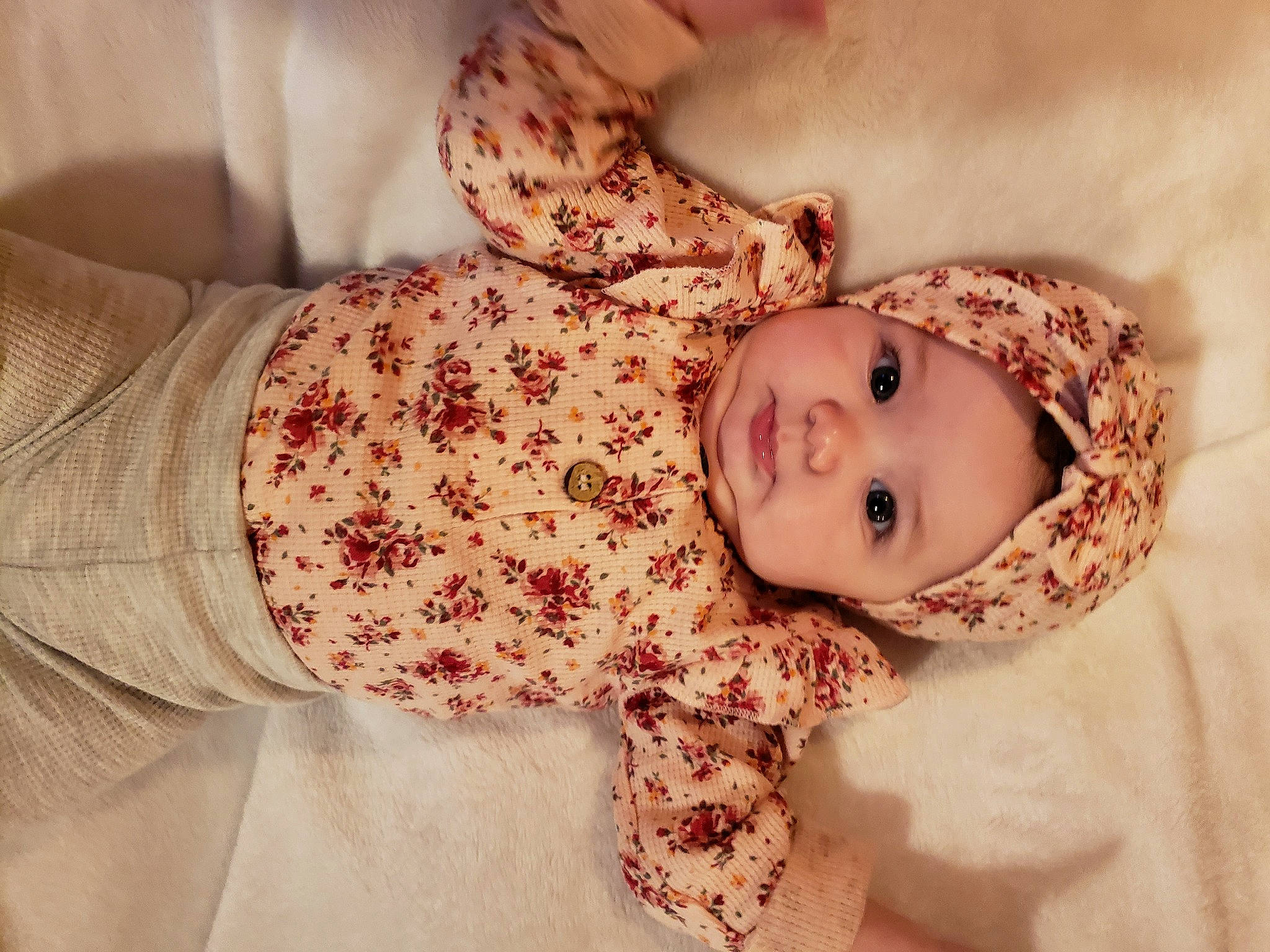 Kora is registered to the contest to win money with this photo: baby, baby_toddler_clothing, brown_hair, cheek, child, comfort, dress, face, flooring, fur, happy, headwear, iris, linens, lip, nose, person, pink, skin, sleeve