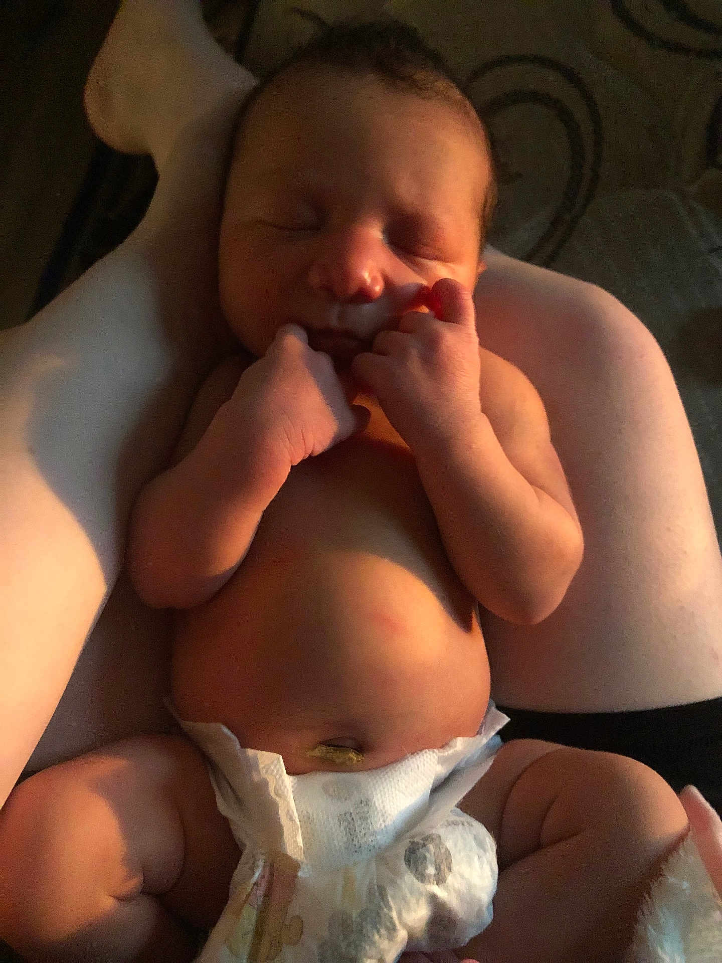 Theodore is registered to the contest to win money with this photo: baby, newborn, sleeping, diaper, infant, arms, skin, peaceful, closeup, person, human, child, cute, small, relaxing, resting, tender, warm, soft_light, indoors