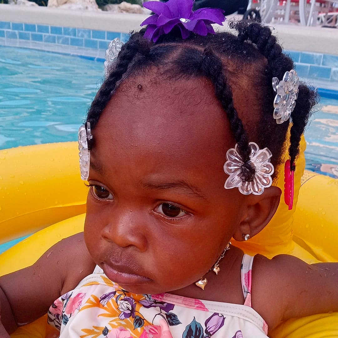 Princess is registered to the contest to win money with this photo: accessories, bodypart, braid, child, cornrows, earring, face, female, girl, hair, head, jewelry, person, photography, pool, portrait, shoulder, skin, swimmingpool, water