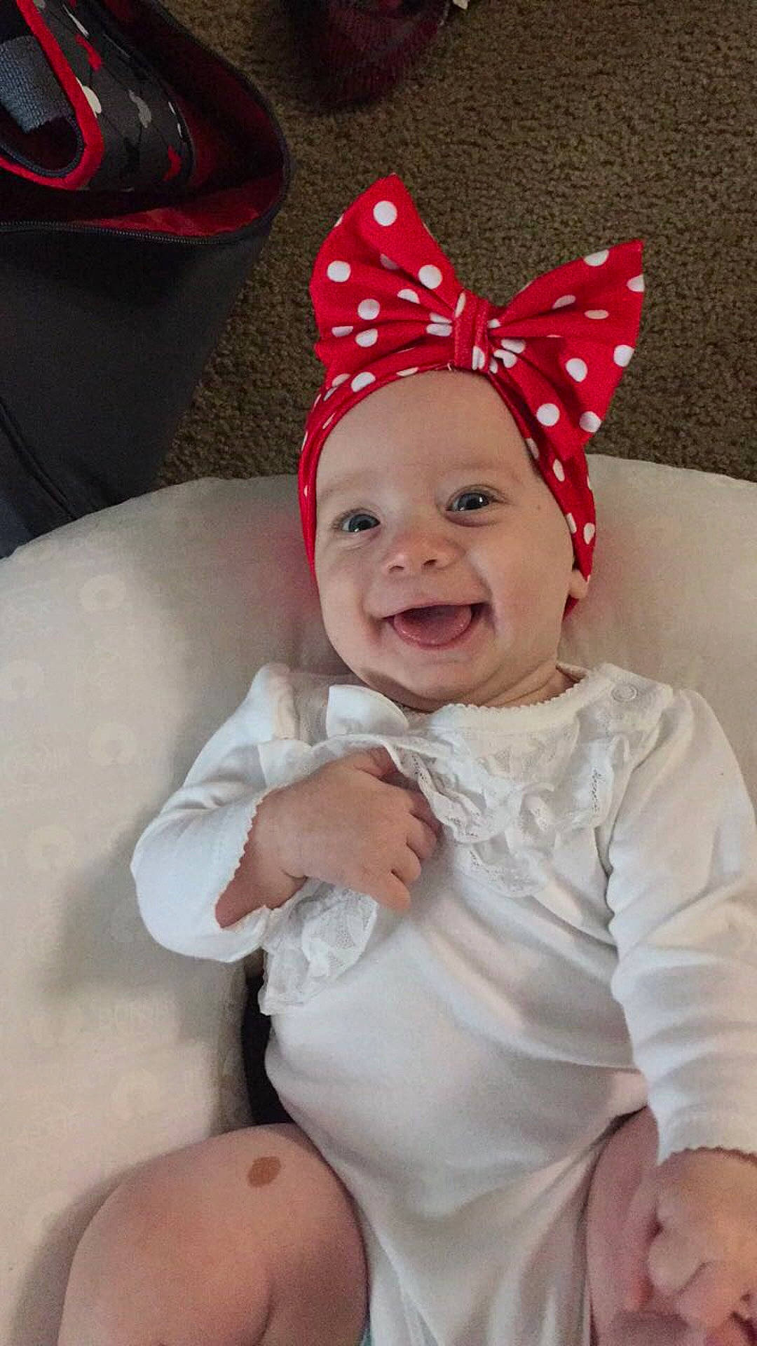 Annabeth joined the competition — help win amazing prizes! beanie, cap, child, ear, fashion_accessory, finger, hair_accessory, hat, headgear, infant, party_hat, person, product, red, skin, smile, toddler