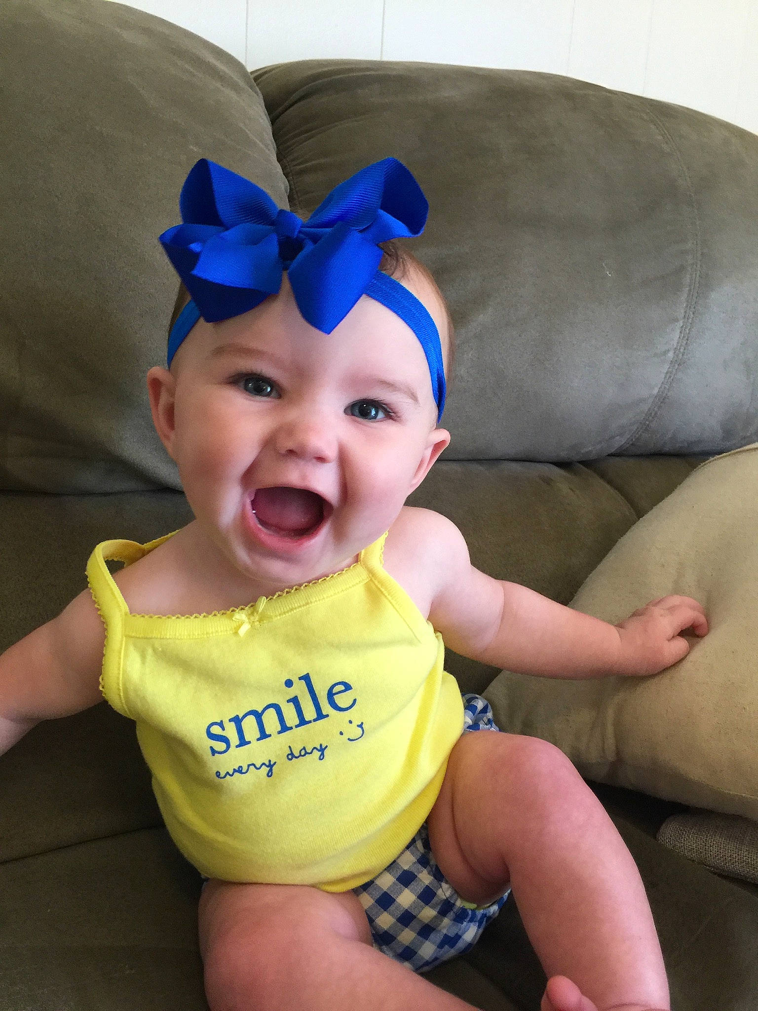 Kate is registered to the contest to win money with this photo: baby, baby_toddler_clothing, child, ear, fun, happy, head, headgear, headwear, mouth, person, smile, toddler, yellow