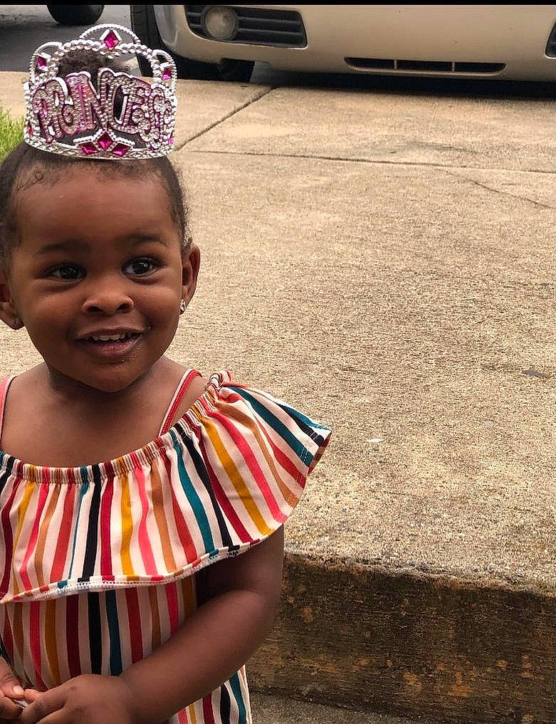 Amylah joined the competition — help win amazing prizes! automotive_exterior, automotive_lighting, crown, dress, eye, eyewear, grass, happy, headpiece, jewellery, joy, person, personal_luxury_car, plant, public_space, smile, street_fashion, temple, tiara, toddler