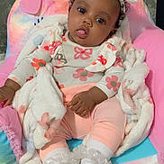 Kezairah is registered to the contest to win money with this photo: baby, blanket, clothing, couch, cushion, face, furniture, glove, hat, head, homedecor, hosiery, indoors, newborn, person, photography, portrait, sitting, sleeping, sock