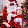 baby, celebration, child, christmas, christmas_tree, decorations, festive, glasses, gloves, happy, holiday, indoor, person, portrait, presents, red_dress, santa_claus, seasonal, smiling, white_beard