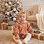 baby, blanket, carpet, child, christmas_tree, couch, cute, decorations, festive, floor, gift, headband, holiday, indoors, portrait, present, sitting, smiling, tights, warm
