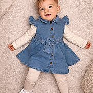 Aëlia a rejoint le concours — aidez-le/la à gagner de superbes lots ! adorable, baby, baby_girl, carpet, casual, child, childrens_clothing, cute, denim_dress, fashion, footwear, happy, indoor, infant, leggings, lying_down, portrait, smiling, soft_texture, white_sneakers