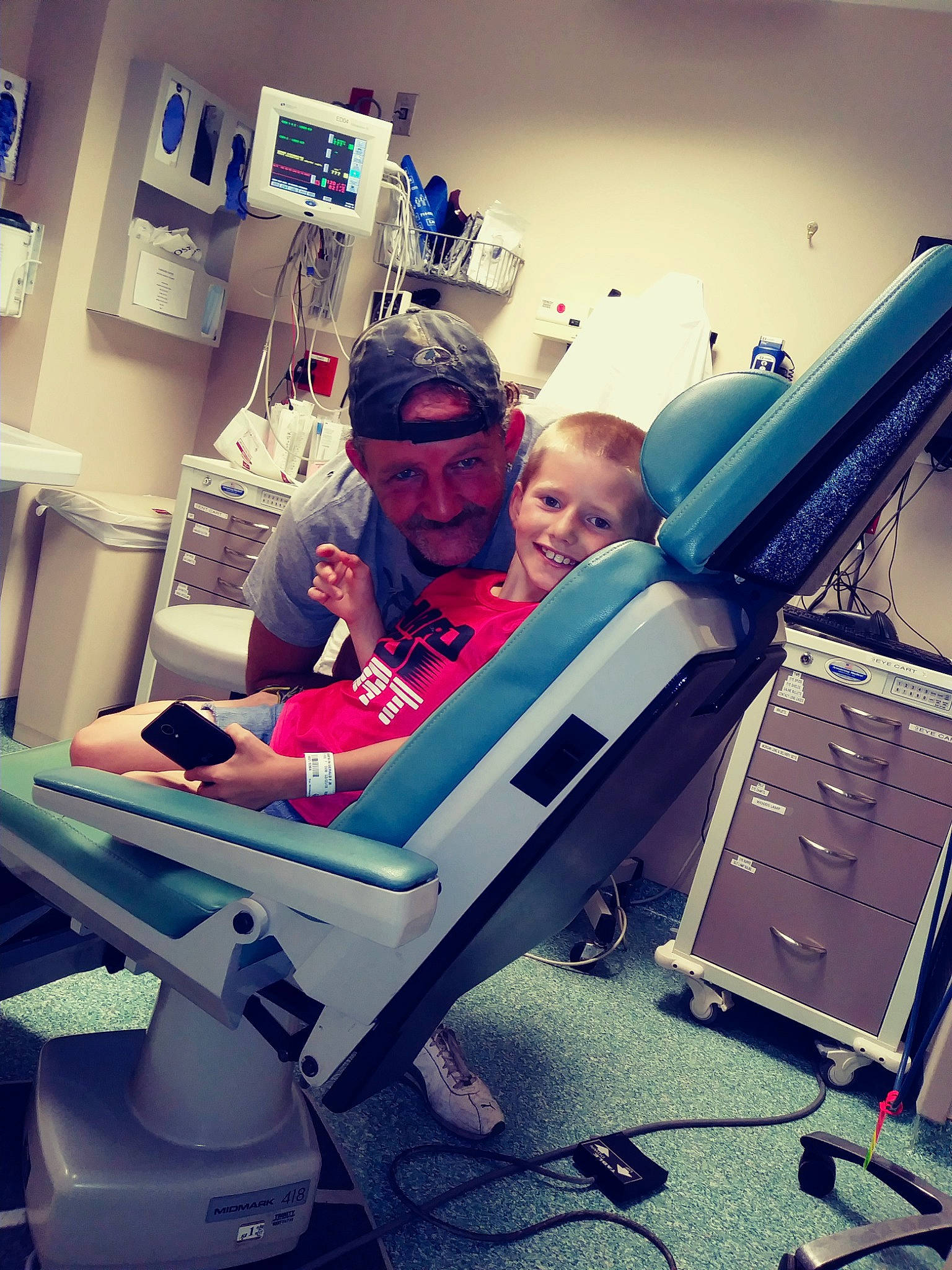 Gerald is registered to the contest to win money with this photo: arm, electronic_device, fun, headwear, health_care, joy, person, product, technology