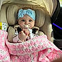 baby, child, car_seat, pacifier, headband, blanket, crochet, pink, white, blue, indoor, seatbelt, clothing, cute, portrait, infant, comfort, car_interior, person, young_child