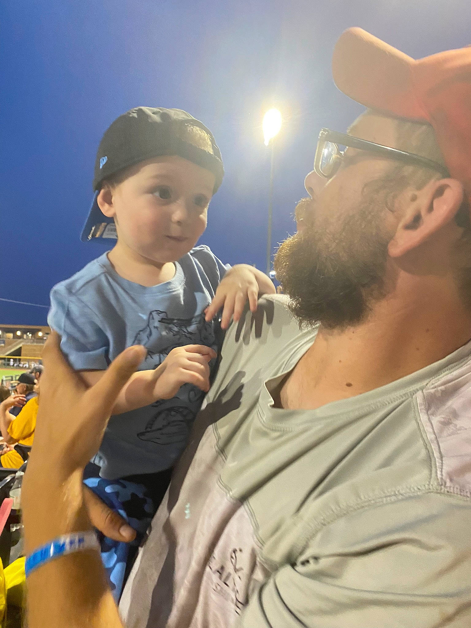 Remington is registered to the contest to win money with this photo: baseball_cap, beard, cap, cool, event, eyewear, flash_photography, fun, gesture, hairstyle, happy, hat, headgear, headwear, human, landscape, leisure, person, shorts, sky