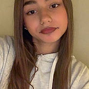 Tanya a rejoint le concours — aidez-le/la à gagner de superbes lots ! child, selfie, portrait, long_hair, brown_hair, hoodie, casual_clothing, earrings, face, eyes, lips, eyebrows, indoor, wall, shoulder, young_person, smile, straight_hair, closeup, neutral_expression