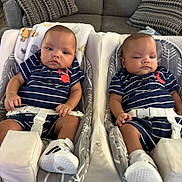 Braxton N Greyson joined the competition — help win amazing prizes! babies, twins, infants, children, matching_outfits, striped_clothing, navy_blue, white, sneakers, baby_seats, bouncers, harnesses, couch, pillows, indoor, portrait, sitting, faces, family, cute