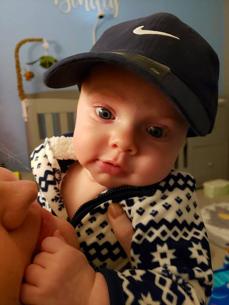 Bentley is registered to the contest to win money with this photo: baby, baby_toddler_clothing, baseball_cap, cap, cheek, child, eye, eyelash, fashion_accessory, finger, hand, hat, headgear, headwear, lip, pattern, person, sleeve, thigh, thumb