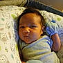 Adrian joined the competition — help win amazing prizes! baby, infant, face, pillow, owl_pattern, mittens, onesie, indoor, bed, sleeping_area, child, cute, newborn, person, closeup, resting, soft_toys, fabric, head, expression