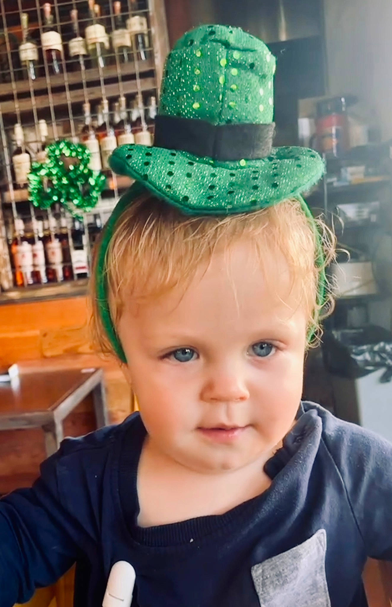 Bruce is registered to the contest to win money with this photo: baseball_cap, cap, child, costume_accessory, costume_hat, event, fashion_accessory, fedora, fun, green, hair_accessory, hat, headgear, headpiece, holiday, party_hat, party_supply, person, saint_patricks_day, sun_hat