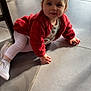 toddler, child, baby, crawling, red_sweater, white_leggings, white_shoes, floor, tile_floor, indoor, natural_light, chair, curious, smiling, young_child, person, casual_clothing, head, hands, eyes