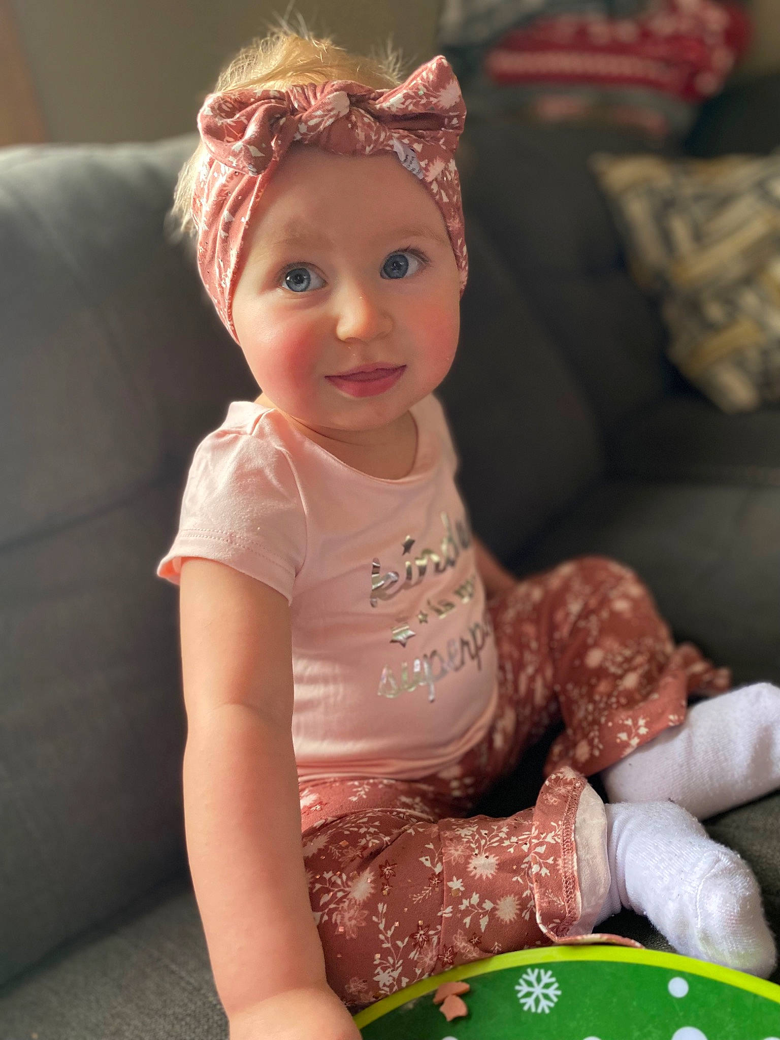 Willow joined the competition — help win amazing prizes! baby_toddler_clothing, child, crown, dress, event, fashion_accessory, fun, gambling, happy, headband, headpiece, headwear, jewellery, pattern, person, recreation, sitting, skin, sleeve, smile