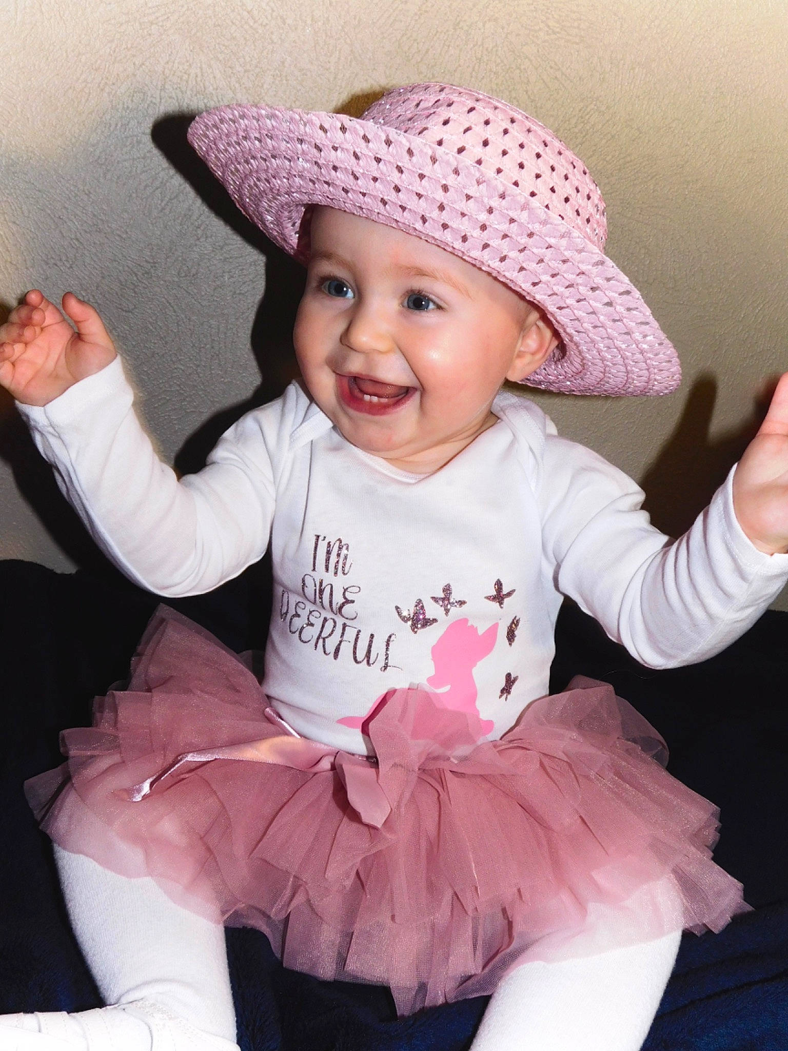 Willow is registered to the contest to win money with this photo: baby_toddler_clothing, child, cool, facial_expression, flash_photography, happy, hat, headgear, headwear, joy, organ, people, person, pink, product, purple, skin, sleeve, smile, sun_hat