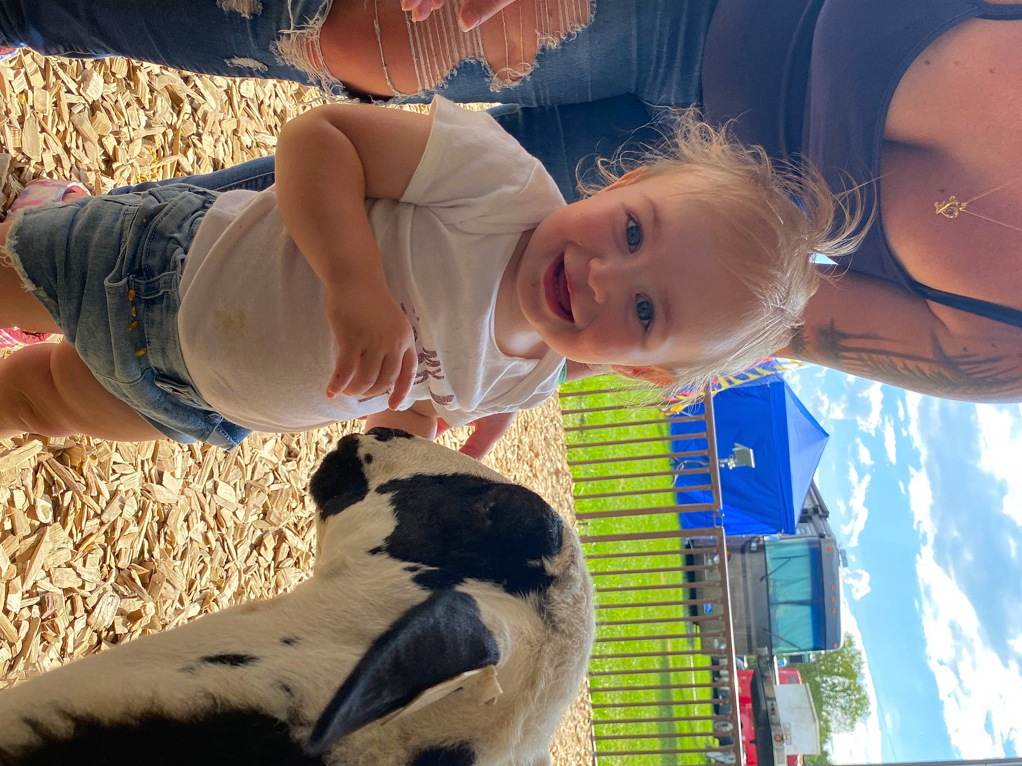 Willow is registered to the contest to win money with this photo: baby, beauty, blue, child, cloud, cool, fun, gesture, grass, happy, human_leg, joy, leisure, light, person, photograph, sky, smile, snapshot, sunglasses