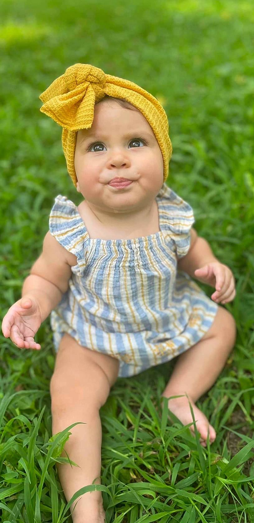 Acacia joined the competition — help win amazing prizes! baby, baby_toddler_clothing, cap, child, facial_expression, finger, fun, grass, grass_family, grassland, green, happy, headwear, joy, leaf, pattern, people_in_nature, person, plant, skin