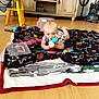 Hudson joined the competition — help win amazing prizes! baby, toy, blanket, floor, cabinet, vacuum_cleaner, plastic, indoor, child, playing, home, wooden_furniture, curious, infant, colorful, chewing, scattered, cozy, stack, cleaning_equipment