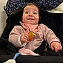 Mia a rejoint le concours — aidez-le/la à gagner de superbes lots ! baby, blanket, cheeks, floral_pattern, food_crumb, hand, happy, indoor, infant, jacket, pacifier_clip, pink_clothing, plush, portrait, ruffle_collar, seatbelt, smile, snack, stroller, wide_eyes