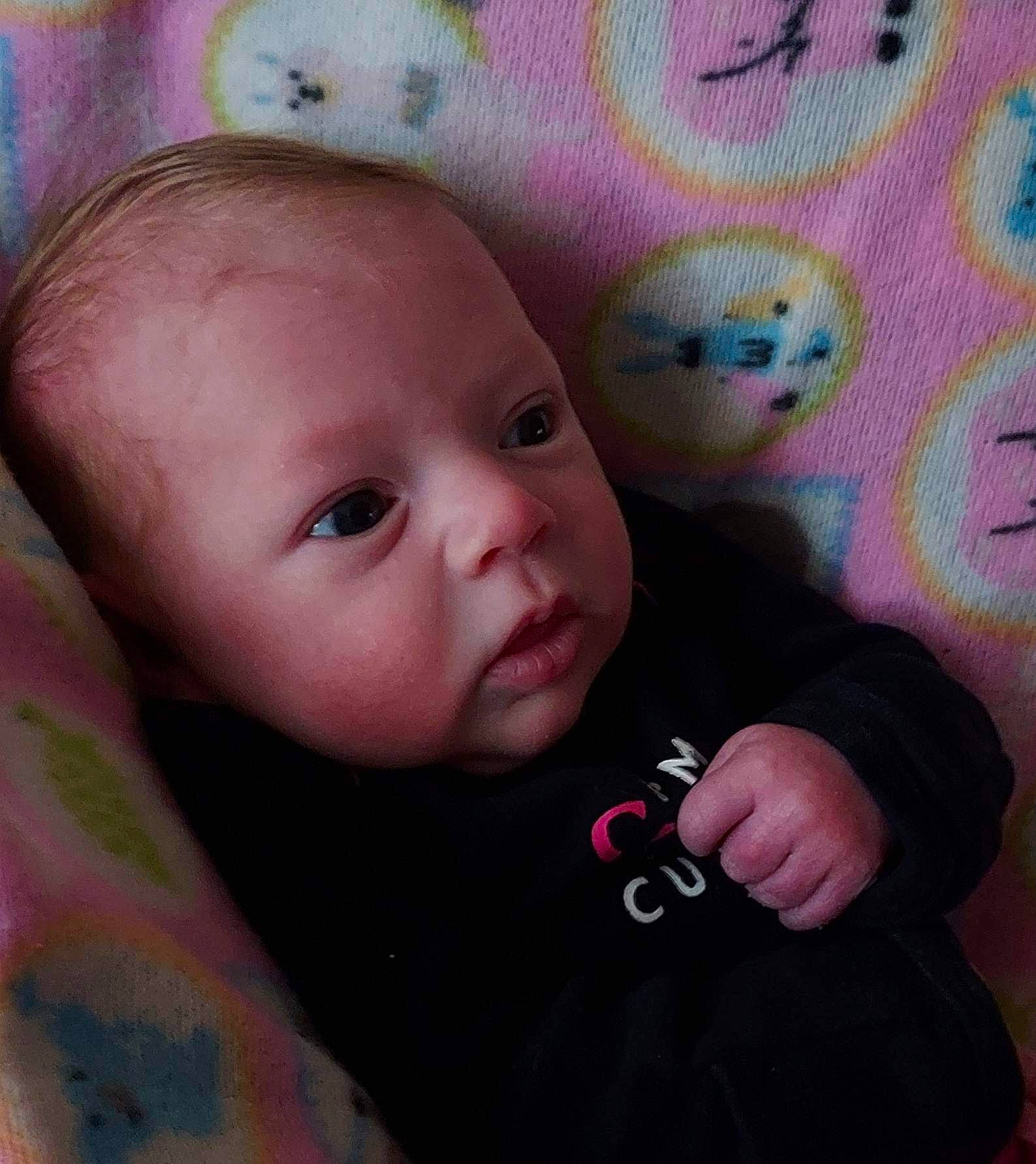 Shilynn is registered to the contest to win money with this photo: baby, baby_toddler_clothing, cheek, ear, eye, eyebrow, eyelash, face, finger, happy, human_body, iris, lip, mouth, nose, outerwear, person, pink, skin, sleeve