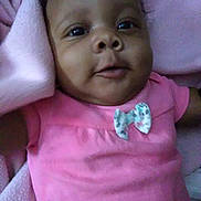 Embher joined the competition — help win amazing prizes! adorable, baby, blanket, bow, child, closeup, cute, expression, face, indoors, infant, lying_down, newborn, person, pink_clothing, portrait, skin, smiling, soft, young_child