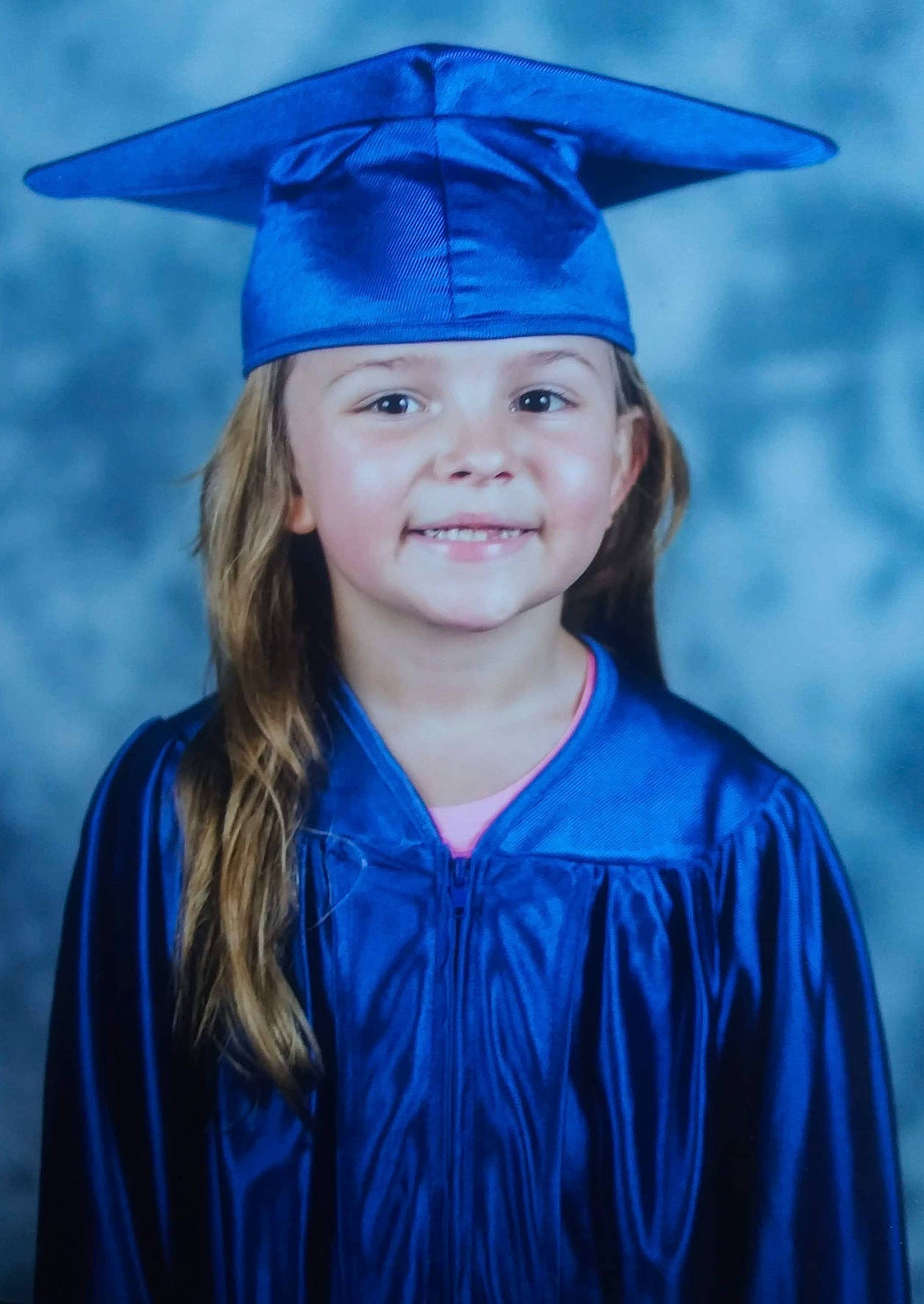 Mckenzie joined the competition — help win amazing prizes! academic_dress, academic_institution, beauty, blue, clothing, electric_blue, eye, fun, graduation, happy, head, headgear, headwear, joy, mortarboard, nature, outerwear, person, purple, scholar