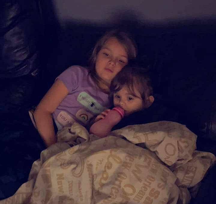 Mckenzie is registered to the contest to win money with this photo: baby, bedding, bedtime, child, cloud, comfort, cool, event, facial_expression, fun, gesture, happy, head, interaction, iris, lap, linens, mouth, person, sitting