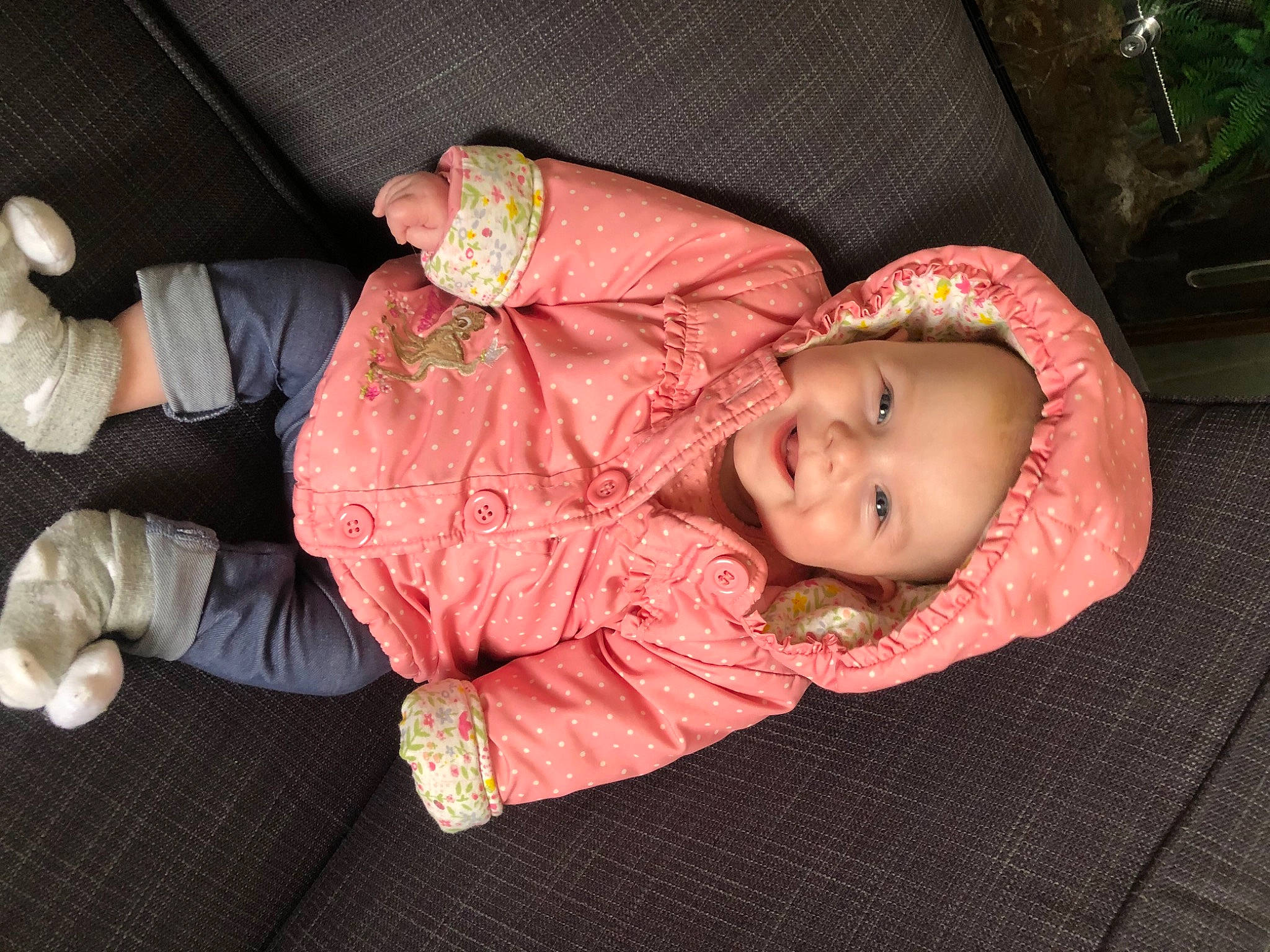 Connie is registered to the contest to win money with this photo: baby, baby_carriage, baby_products, baby_toddler_clothing, cheek, child, clothing, comfort, face, flooring, head, joy, lap, person, pink, sitting, skin, sleeve, smile, toddler