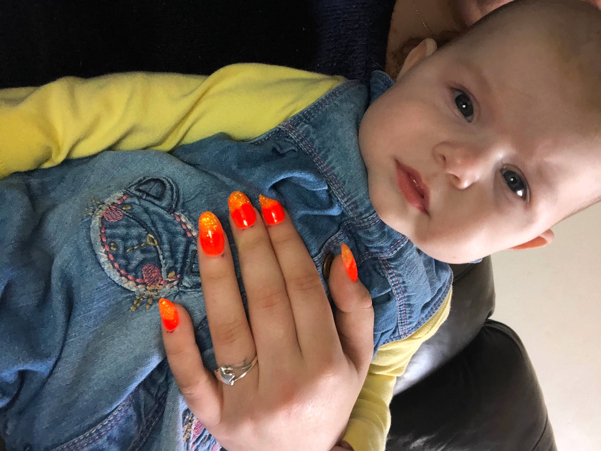 Connie is registered to the contest to win money with this photo: baby_toddler_clothing, cheek, clothing, eye, eyelash, finger, gesture, hand, happy, head, human_body, iris, lip, mouth, nail, neck, nose, person, skin, smile
